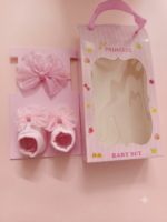Baby girl's charm with this elegant set featuring a soft, shimmering bow headband and matching cushioned booties - Image 2