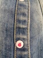 stylish light-wash denim jacket featuring playful sleeve graphic with ladybug cute buttons - Image 3